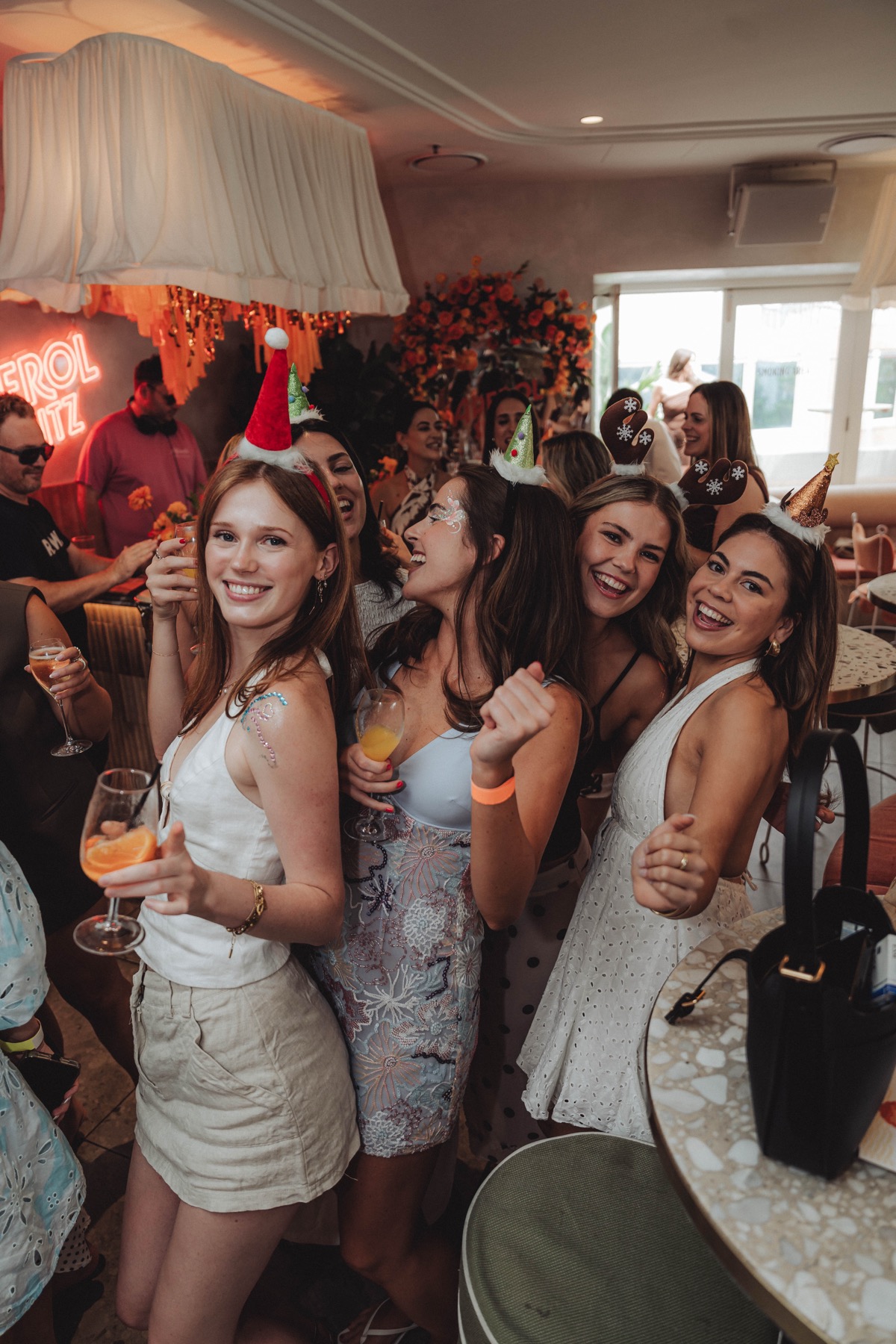 Guests celebrating with cocktails at a private party