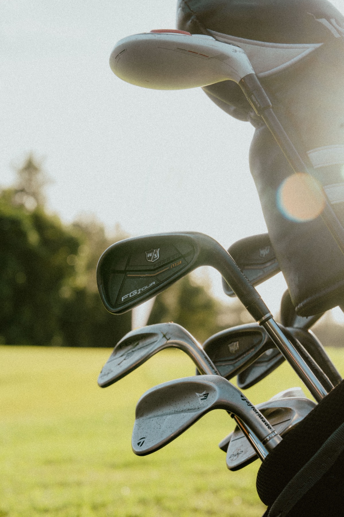 Golfer mid-swing at a corporate golf day